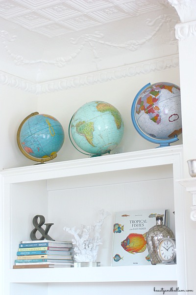 I love the pops of color from these globes against the white walls