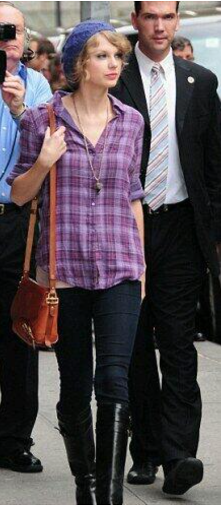 Taylor Swift wearing plaid shirt with long boots